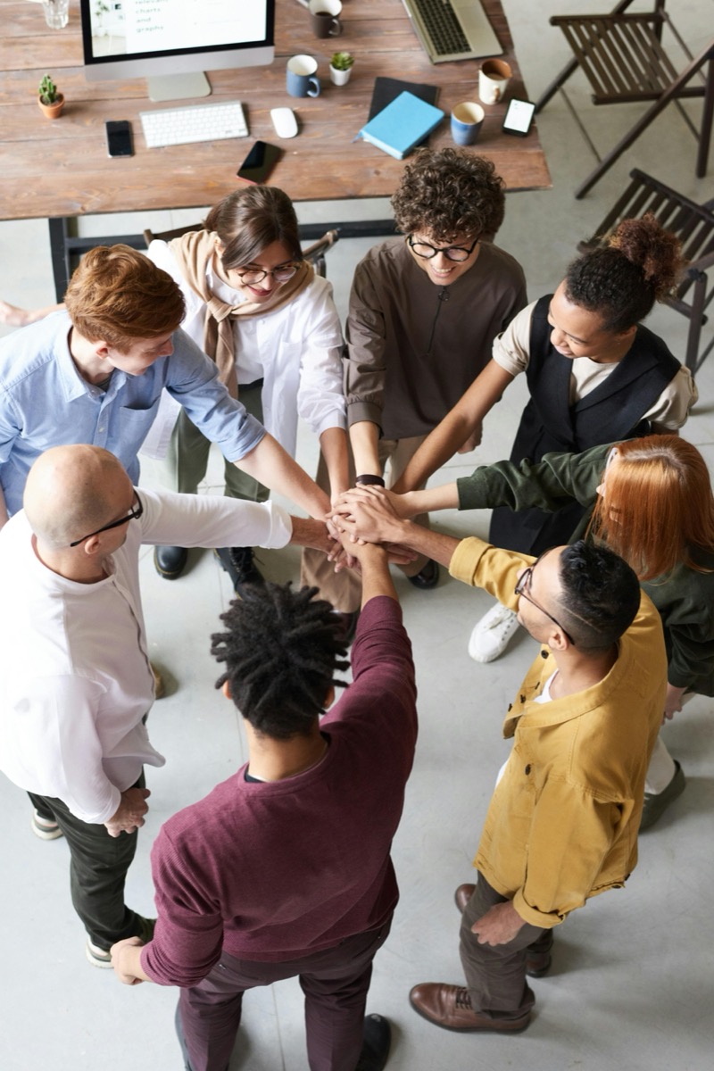 Professional team collaborating together - successful team building